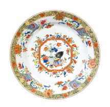 A Chinese Porcelain Dish, early Qianlong, of circular form, painted in famille rose enamels with
