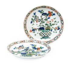 A Pair of Chinese Porcelain Saucers, Kangxi, painted in famille verte enamels with baskets of