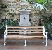 A Victorian Cast Iron and Later Painted Garden Bench, late 19th century, the scrolled end supports