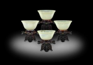~ A Set of Four Chinese Pale Celadon Jade Bowls, Qing Dynasty, probably Qianlong, of circular form