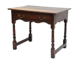 A George II Oak Side Table, mid 18th century, the boarded top above an oak-lined frieze drawer and