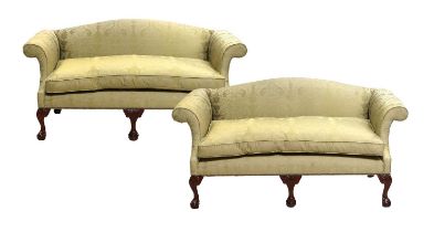 A Pair of George III-Style Two-Seater Sofas, modern, covered in green silk damask, the overstuffed