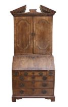 A George II Walnut and Crossbanded Bureau Bookcase, 2nd quarter 18th century, the architectural