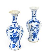 A Pair of Chinese Porcelain Vases, Kangxi, of baluster form with tall trumpet necks, painted in