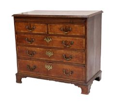 A George III Oak and Mahogany-Crossbanded Straight-Front Chest of Drawers, late 18th century, the