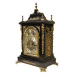 An Ebonised Chiming Table Clock, circa 1890, inverted bell top case with urn shaped finials, side