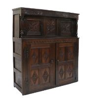 A Late 17th Century Joined and Carved Oak Court Cupboard, initialled RS and dated 1676, the carved