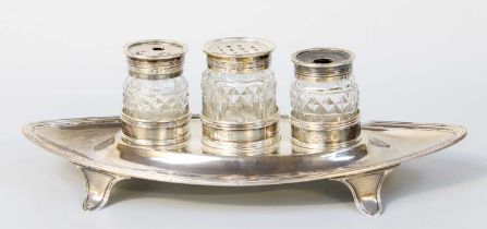 A George III Silver Inkstand, by John Emes, London, 1799, oval and on four tapering feet, with