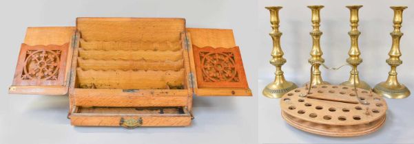 An Edwardian Oak Fitted Stationary Cabinet, a set of four large brass table candlesticks and a