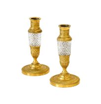 A Pair of Gilt Metal Mounted Cut Glass Dwarf Candlesticks, circa 1820, of baluster form with bands