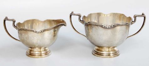 A George V Silver Cream-Jug and Sugar-Bowl, by Frank Cobb, Sheffield, 1932, each piece tapering