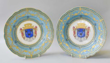 A Pair of Sèvres Style Porcelain Plates, 20th century, painted to the centres with coats of arms