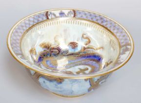 A Wedgwood Dragon Lustre Bowl, by Daisy Makeig-Jones, in mottled pale blue ground and with three