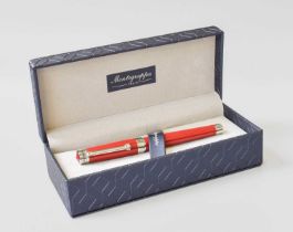 A Montegrappa Parola Amarone Fountain-Pen, the red resin body with white metal mounts, with
