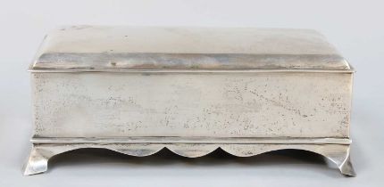 An Edward VII Silver Cigarette-Box, by William Comyns, London, 1904, oblong and on four tapering