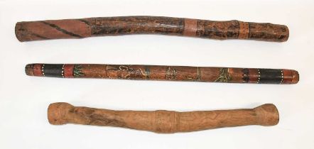 An Australian Aboriginal Didgeridoo, in ironwood stained with red pigment and incised with panels of