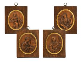 A Set of Four Bas-Relief Carved Wooden Medallions, Germany or Low Countries, early 18th century,