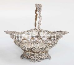 A Victorian Silver Basket, by William Comyns, London, 1893, oval and on spreading pierced foot,