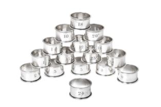 A Set of Sixteen Edward VII Silver Napkin-Rings, by Walker and Hall, Chester, 1907, each plain,