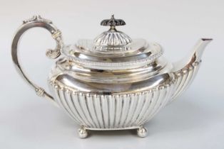 An Edward VII Silver Teapot, by James Dixon and Sons, Sheffield, 1909, oval and on four ball feet,