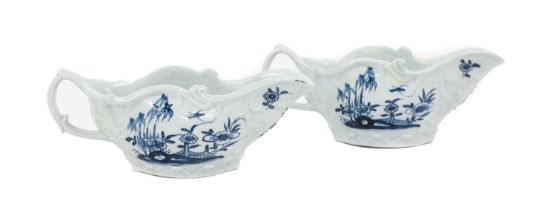 A Near Pair of Chaffers Liverpool Porcelain Sauceboats, circa 1760, of scroll moulded oval form,