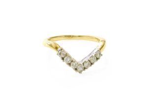 An 18 Carat Gold Diamond Wishbone Ring, seven round brilliant cut diamonds in white claw settings,