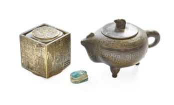 A Chinese Metal Puzzle Box / Seal, together with a copper alloy miniature with niello decoration and