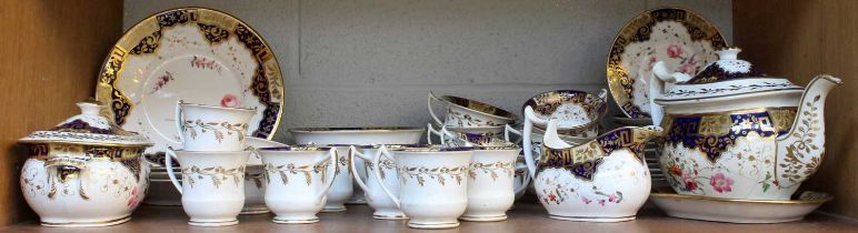 A Spode Porcelain Tea and Coffee Service, circa 1830, with wet blue and gilt borders, painted with