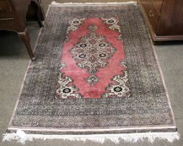 Signed Lahore "Bukhara" Rug, the field with central medallion enclosed by multiple borders, 187cm by