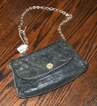 Circa 1980s Black Leather Quilted Chanel Shoulder Bag, with curved flap, gilt metal 'coin' style
