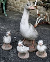 Four Cast Composition Garden Statues, modelled as a goose and three goslin, goose, 62cm high