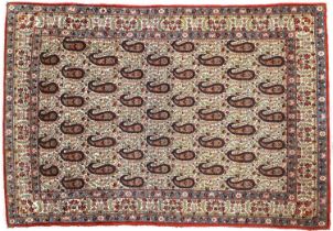Ghom Rug Central Iran, Circa 1950 The ivory field with a one way design of boteh enclosed by ivory