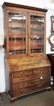 A George III Mahogany Bureau Bookcase, inlaid and fully fitted, the lower section decorated with