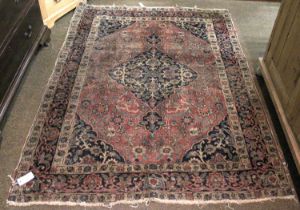 Tabriz Rug, the madder field of vines centred by an indigo medallion framed by spandrels and