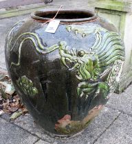 An Oriental Glazed Terracotta Urn, of ovoid form and decorated in relief with a dragon, 80cm