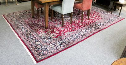 Kirman Carpet, the field of vines centered by a large flowerhead medallion framed by ivory spandrels