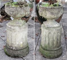 A Pair of Classical Style Composition Garden Planters, with swag decoration and on fluted columns,