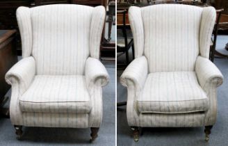 A Pair of Modern Wing Back Armchairs, with striped upholstery In good condition.