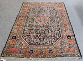 Hamadan Rug, the indigo Herati field centred by a madder and pale blue flowerhead medallion,