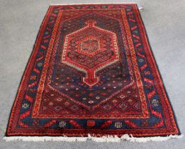 Hamadan Rug, the indigo field with central hooked medallion framed by spandrels and serrated leaf