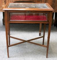 An Edwardian Satinwood Banded Bijouterie Table (lacking key but open), 64cm by 41cm by 76cm With