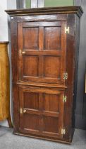 An 18th Century Oak Two Door Cupboard, with panelled doors, 97cm by 46cm by 181cm