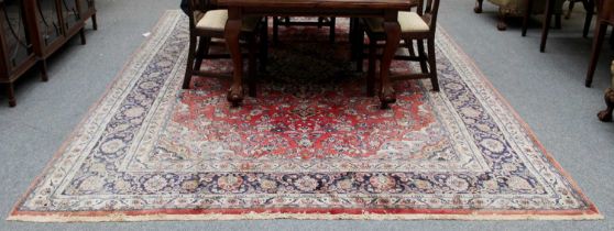 Hamadan Carpet, the blood red field of vines around an indigo and ivory medallion, framed by