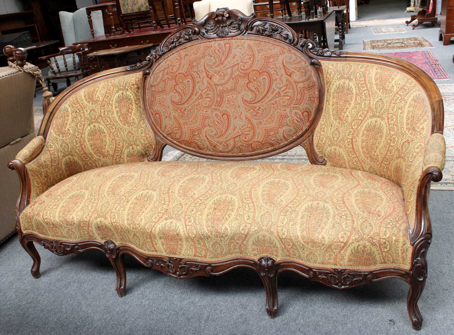 A Mid Victorian Carved Rosewood Settee Dimensions - 110cm by 180cm by 70cm Top section of carved