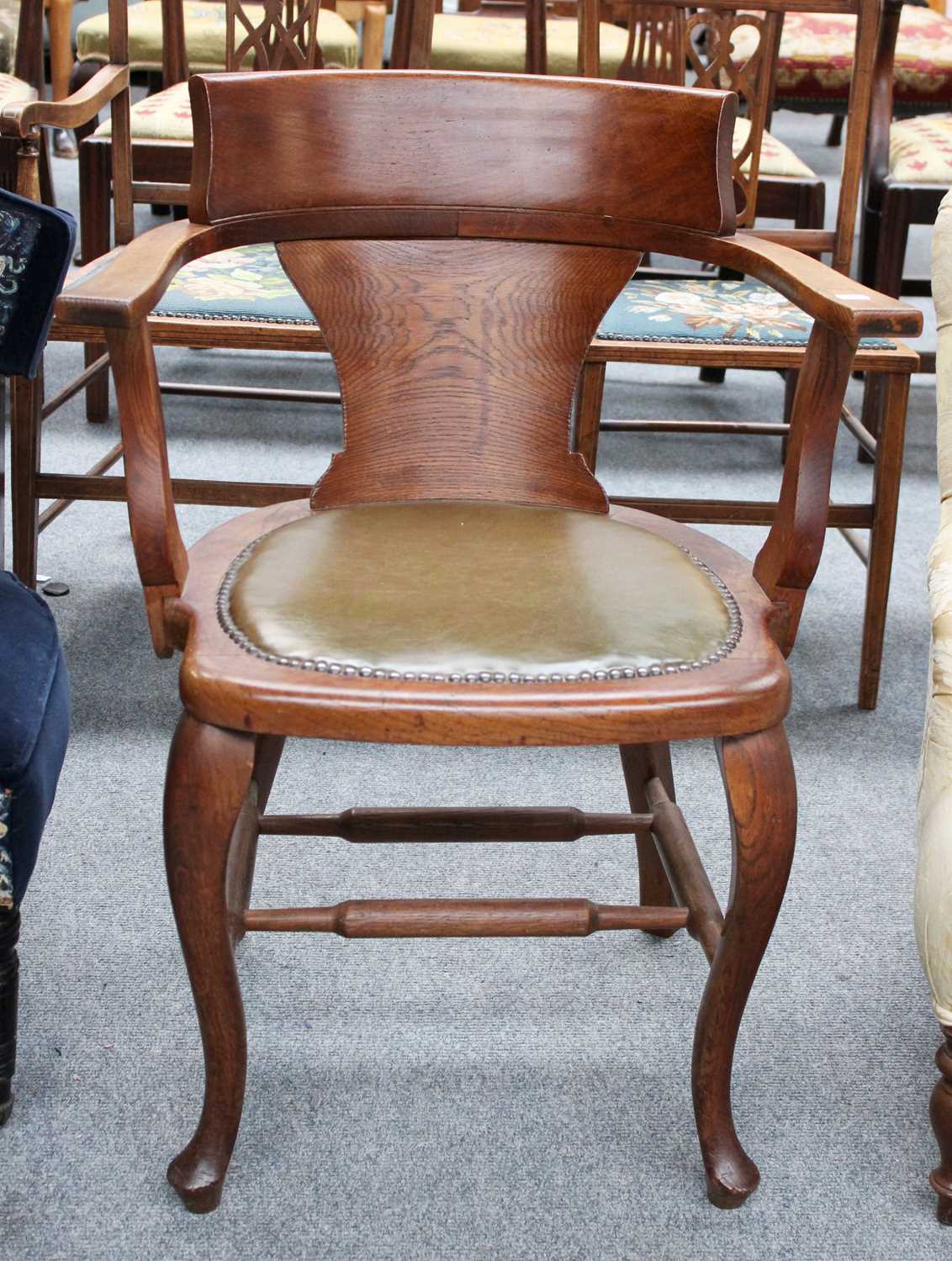 An Oak Desk Chair, with studded leather seat back