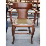 An Oak Desk Chair, with studded leather seat back