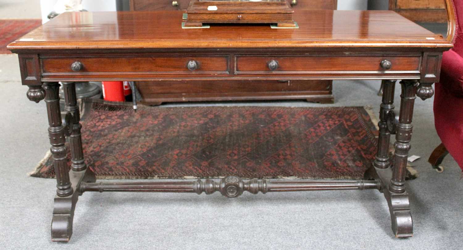 A Victorian Mahogany Two Drawer Side Table, on fluted supports with similar stretchers, 136cm by