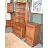 A Group of Ercol Elm Furniture: comprising bookcase cabinet, 98cm, by 48cm by 197cm, single doorn