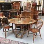 A 20th Century Oak Gate Leg Table, 133cm by 107cm by 74cm, and a set of four Windsor side chairs