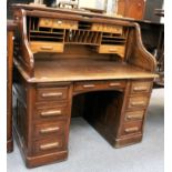 An Oak 'Standard' Roll Top Desk, 1920s, fitted in typical fashion, 126cm by 82cm by 127cm,